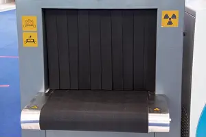 Examine Prints: Baggage x-ray scanner airport security service scanner and conveyor belt with passenger luggage bag