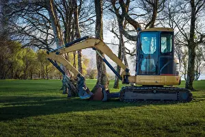 Out Of Context Prints: Bagger or excavator among trees at the Golf and fishing club