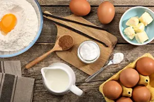 Acid Prints: Baking powder in bowl surrounded by other products on wooden table, flat lay