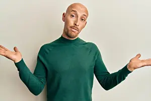 Helpless Prints: Bald man with beard wearing casual turtleneck sweater clueless and confused with open arms