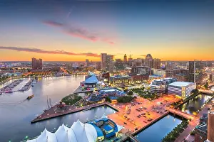 Baltimore, Maryland, USA city skyline over the Inner Harbor at twilight