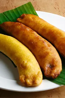 Banana fry is a snack in which banana slices are coated with batter and deep fried