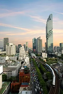 Bangkok Transportation before sunset with Modern Business Building from top view in Bangkok, Thailand