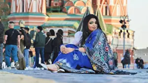 Saree Prints: Bangladeshi woman wearing blue saree sitting on Red Square in Moscow, Russia
