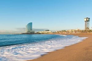 Images Dated 10th April 2018: Barceloneta Beach in Barcelona with colorful sky at sunrise. Seafront, beach, coast in Spain