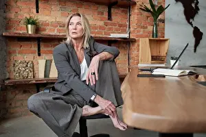 Well Dressed Prints: Barefoot businesswoman in office