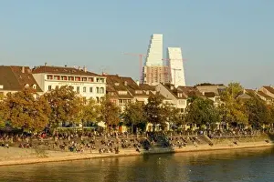 Rhein Prints: Basel, Switzerland - 17 Oktober 2021: people relaxing by the river Rhine at Basel in Switzerland