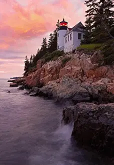 Keeper Prints: Bass Harbour Lighthouse at sunset with dramatic rocks and Atlantic Ocean on the foreground