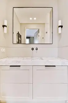 Vanity Prints: a bathroom with white cabinets and marble counter tops on the vanity top