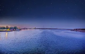 Milky Way Prints: A bay with blue water, an grassland island Provestenen Syd with small houses