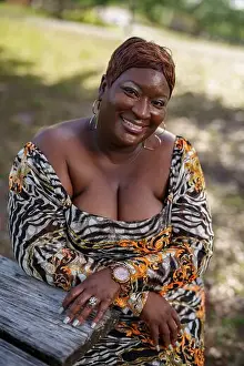 Well Being Prints: BBW big black beautiful model sitting on a park bench outdoors