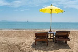 Images Dated 10th December 2017: Beach Chairs and Umbrella on summer island in Phuket, Thailand