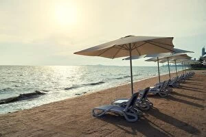 Images Dated 16th May 2018: Beach Chairs and Umbrella on summer island in Phuket, Thailand