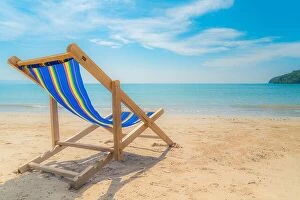 Images Dated 10th December 2017: One beach chairs on the white sand with blue sky and summer sea background