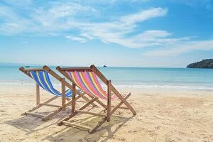 Images Dated 10th December 2017: Two beach chairs on the white sand with blue sky and summer sea background