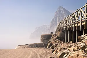 Bunker Prints: Detail of beach with old bunker and The Rock of Gibraltar on the background
