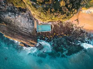Beach rock pool tidal pool built against the cliff in the rocks at the end of the beach for public swimming recreation