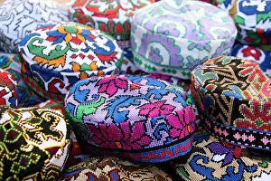 Headwear Prints: Beaded souvenir hats on sale in Central Asia