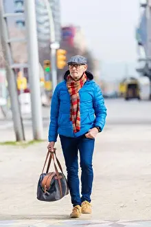 Goggles Prints: bearded grandfather with a handbag walks on the street
