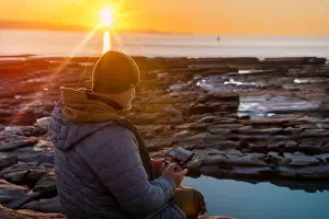 Remote Control Prints: Bearded man using a drone with remote controller making photos and videos