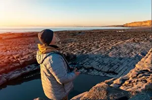 Remote Control Prints: Bearded man using a drone with remote controller making photos and videos