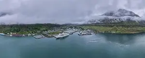 Lgbt Prints: Beautiful aerial view of the town of Seydisfjordur and its Blue church and rainbow street