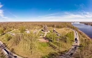 Beautiful Aerial view to traditional Russian village with orthodox wooden chapel and bell tower in Bogoslovka manor