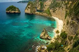 beautiful aerial view of tropical paradise beach and rock cliff with amazing turquoise sea water