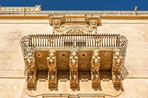 Epoch Prints: Beautiful ancient baroque balcony with horse ornaments in Noto, Sicily, Italy