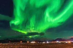 Magnetic Prints: Beautiful Aurora Borealis over house on the island of Kvaløya