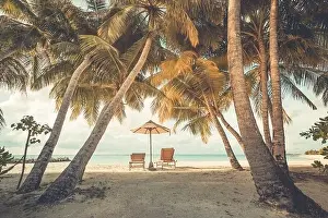 Beautiful beach. Chairs on the sandy beach near the sea. Summer holiday and vacation concept for tourism. Tranquil scenery, relaxing beach, wonderful
