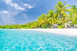 Beautiful beach resort, coast, shore with white sand and palm trees. Amazing summer holiday vacation concept, luxury travel destination. Tropic beach