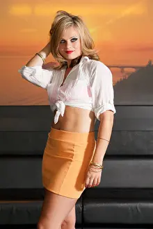 Make Up Prints: Beautiful blonde girl wearing an orange mini-skirt