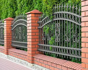 City Day Prints: Beautiful brick fence with iron railing outdoors