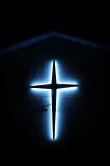 Crucifix Prints: Beautiful Bright Neon Blue Cross on Side of a church building in Wisconsin