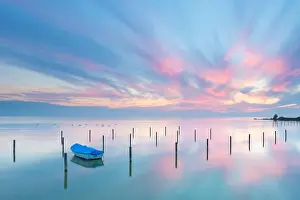 Scenic Landscape Prints: A beautiful calm and tranquil sunset with bright blue and pink colors