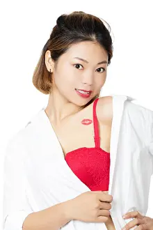Seduce Prints: Beautiful Chinese woman a red lipstick kiss on her chest isolated on a white background