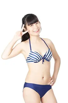 Swimsuit Prints: Beautiful Chinese woman wearing a sexy bikini isolated on a white background