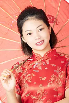 Hand Gesture Prints: Beautiful Chinese woman wearing a traditional dress known as a Cheongsam or Chipao isolated on a white background