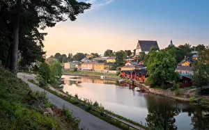 Beautiful city landscape with idyllic river and old buildings at summer evening in Porvoo, Finland