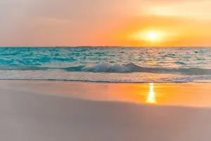 Beautiful cloudscape seascape, sunrise sunset view. Calm sea waves splashing on soft sand, relaxing nature beach, tranquil summer landscape, inspire