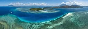 Aerial Landscape Collection: A beautiful coral reef fringes a channel in the Lesser Sunda Islands of Indonesia