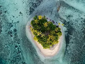 Melanesia Prints: A beautiful coral reef surrounds a scenic island in the Solomon Islands