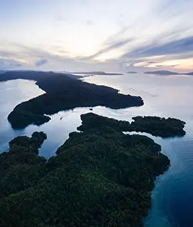 Raja Ampat Prints: Beautiful coral reefs fringe remote limestone islands in Raja Ampat