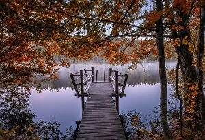 Images Dated 29th September 2018: Beautiful fall colors with wooden pier and peaceful lake at autumn morning in Finland
