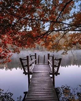 Images Dated 29th September 2018: Beautiful fall colors with wooden pier and peaceful lake at autumn morning in Finland