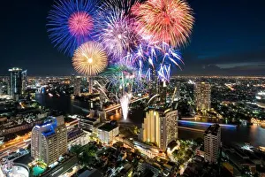 Chao Phraya River Prints: Beautiful fireworks celebrating loy krathong festival or New year along Chao Phraya River in Bangkok