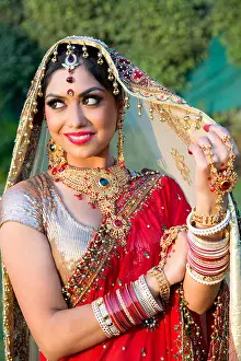 Beautiful Woman Prints: Beautiful Indian bride in traditional wedding dress and posing