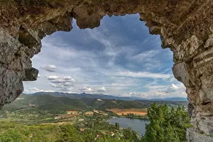 Amazing Landscape Prints: Beautiful lake Piediluco view and the ancient town Labro on the hill from the window of an old ruined castle