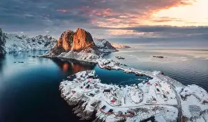 Norge Prints: Beautiful landscape of aerial view of snowy mountain and fishing village on coastline in winter at Lofoten Islands